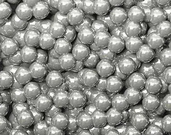 TR3000 SEM image of rounded abrasive particles