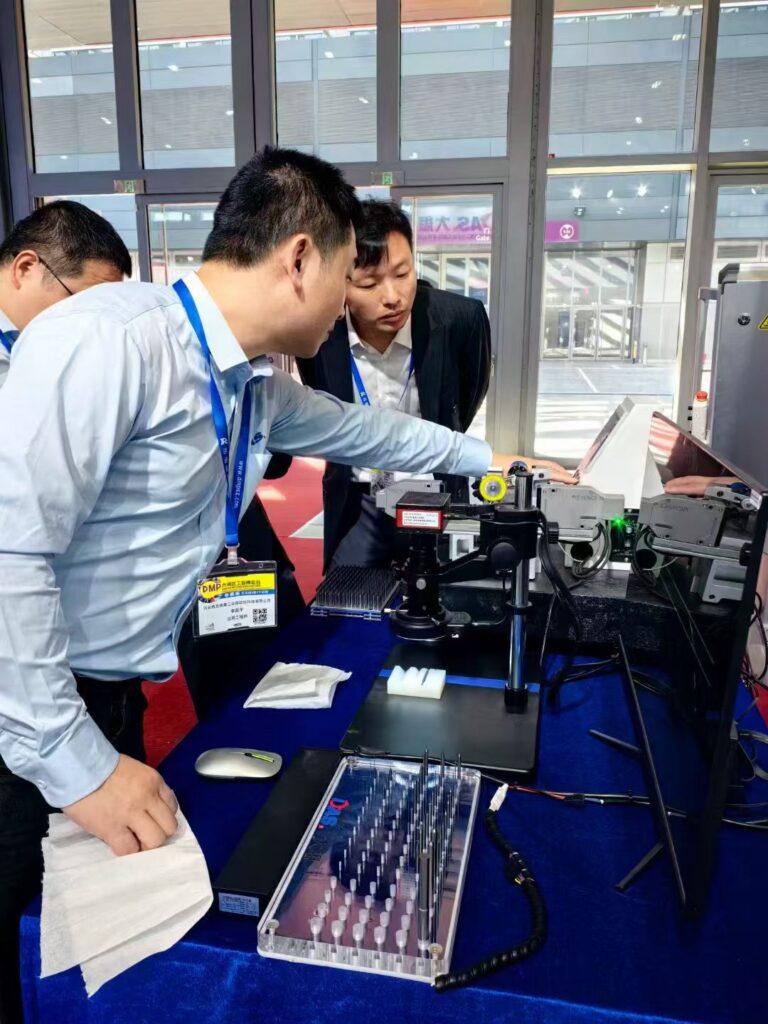 People examining an exhibition display
