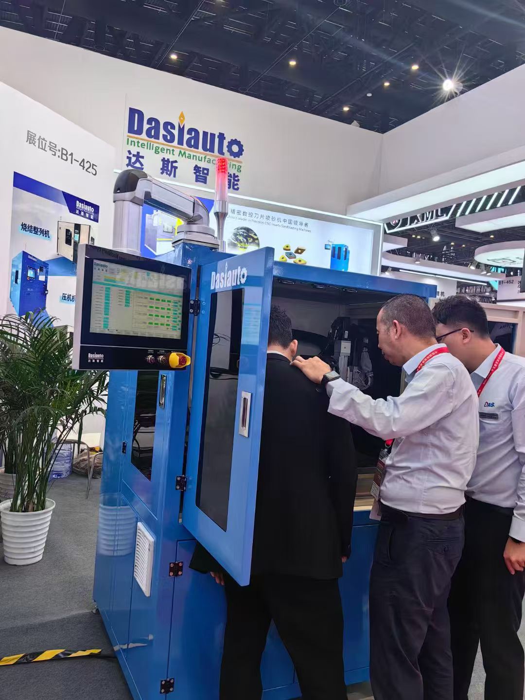 People beside a machine at an exhibition