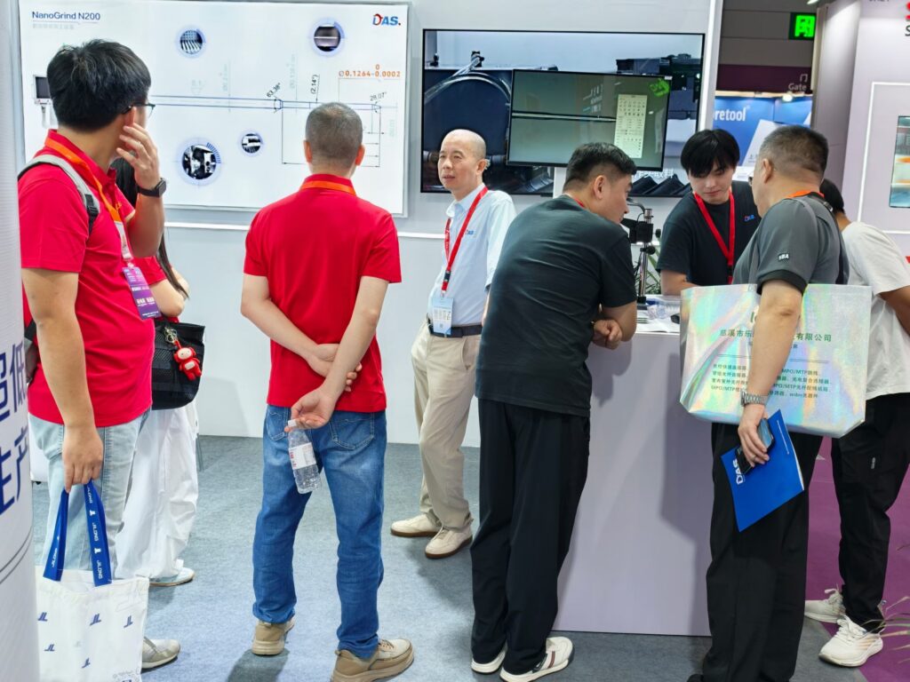 People beside equipment at an exhibition