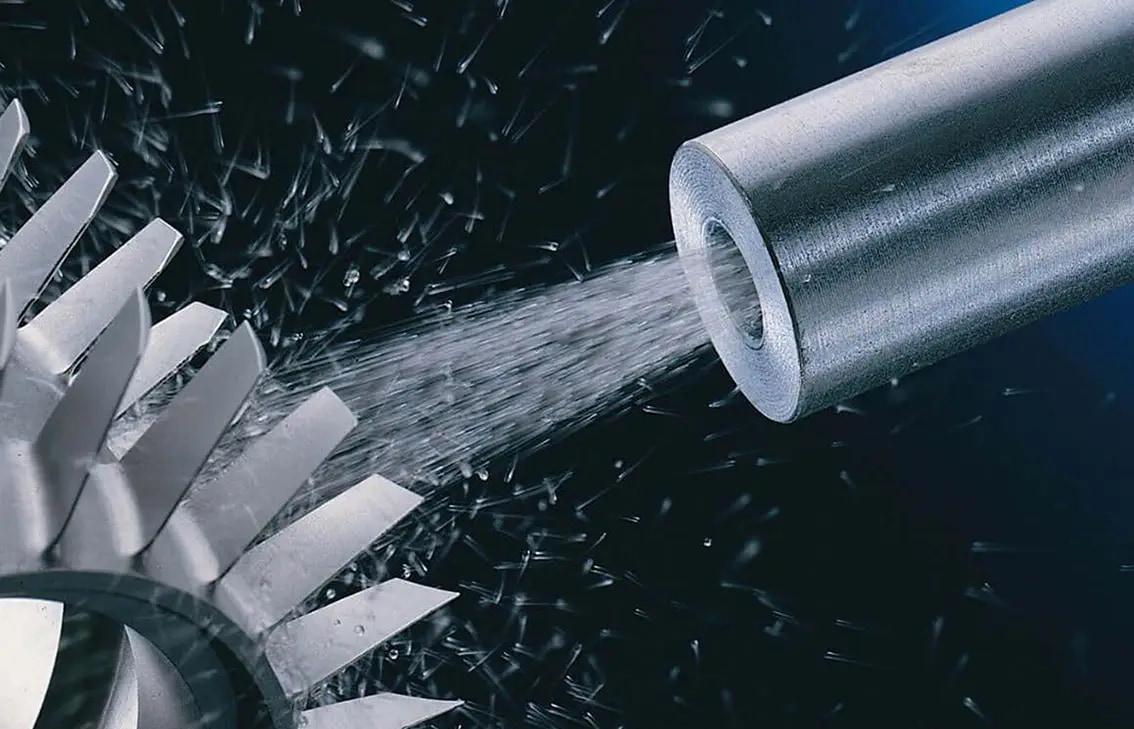 Illustration of a nozzle directing a particle stream toward a bladed component
