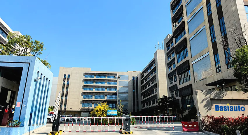 Factory buildings, entrance gate and DasiAuto sign